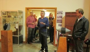 Museum President Patrick Day opens the exhibition flanked by two of the sculptures and Richard Page (right)