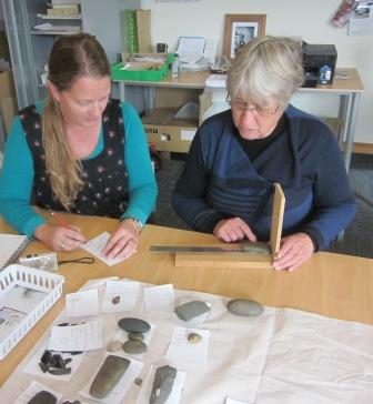 Cataloguer Karyn Willoughby working with consultant Lyn Williams on some artefacts from the collection