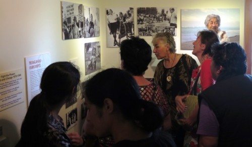 Rickard family members study the exhibit at the opening.