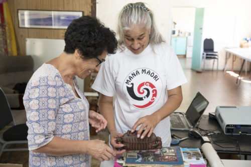 Rangi and Angeline Greensill checking out a waka huia. Photograph by Maarten Holl, Te Papa